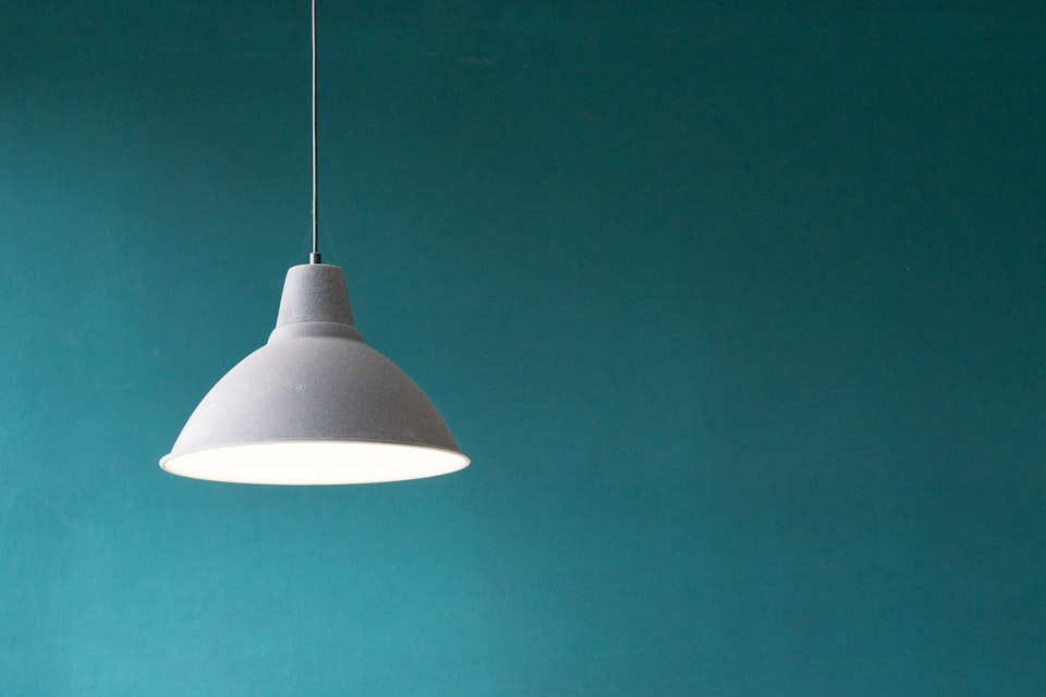 Table lamp glowing in a dim room
